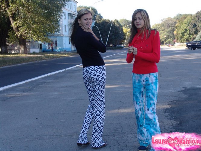 Teenager lesbians Laura and Katrina flaunt their tits and buttocks while out and about.
