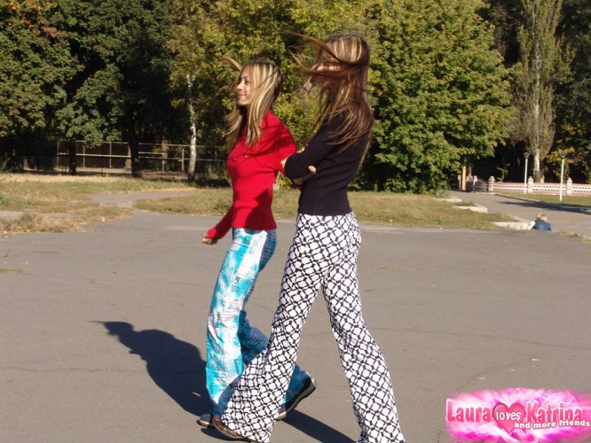 Teen lesbians Laura & Katrina flash their tits and butts while wandering about