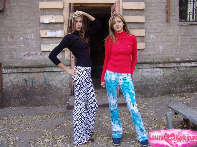 Teen lesbians Laura & Katrina flash their tits and butts while wandering about