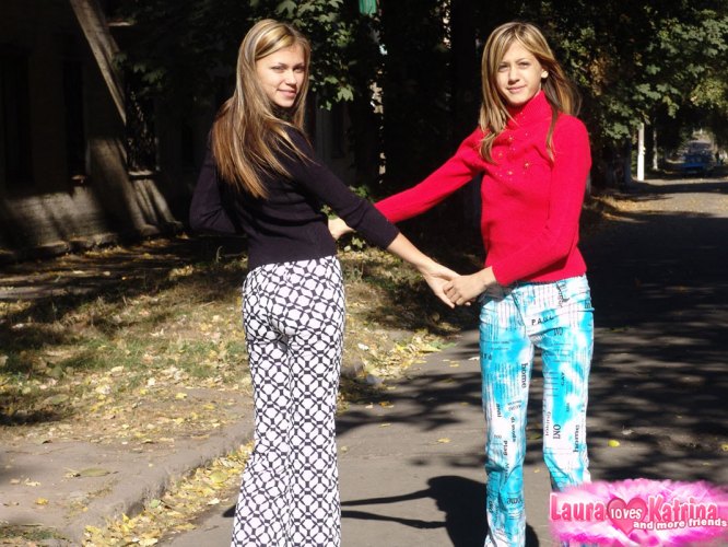 Teen lesbians Laura & Katrina flash their tits and butts while wandering about
