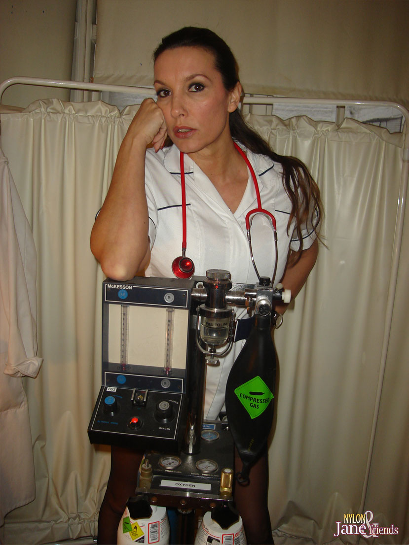 Mature nurse Nylon Jane exposes her upskirt panties on a vintage medical chair foto porno #425356857