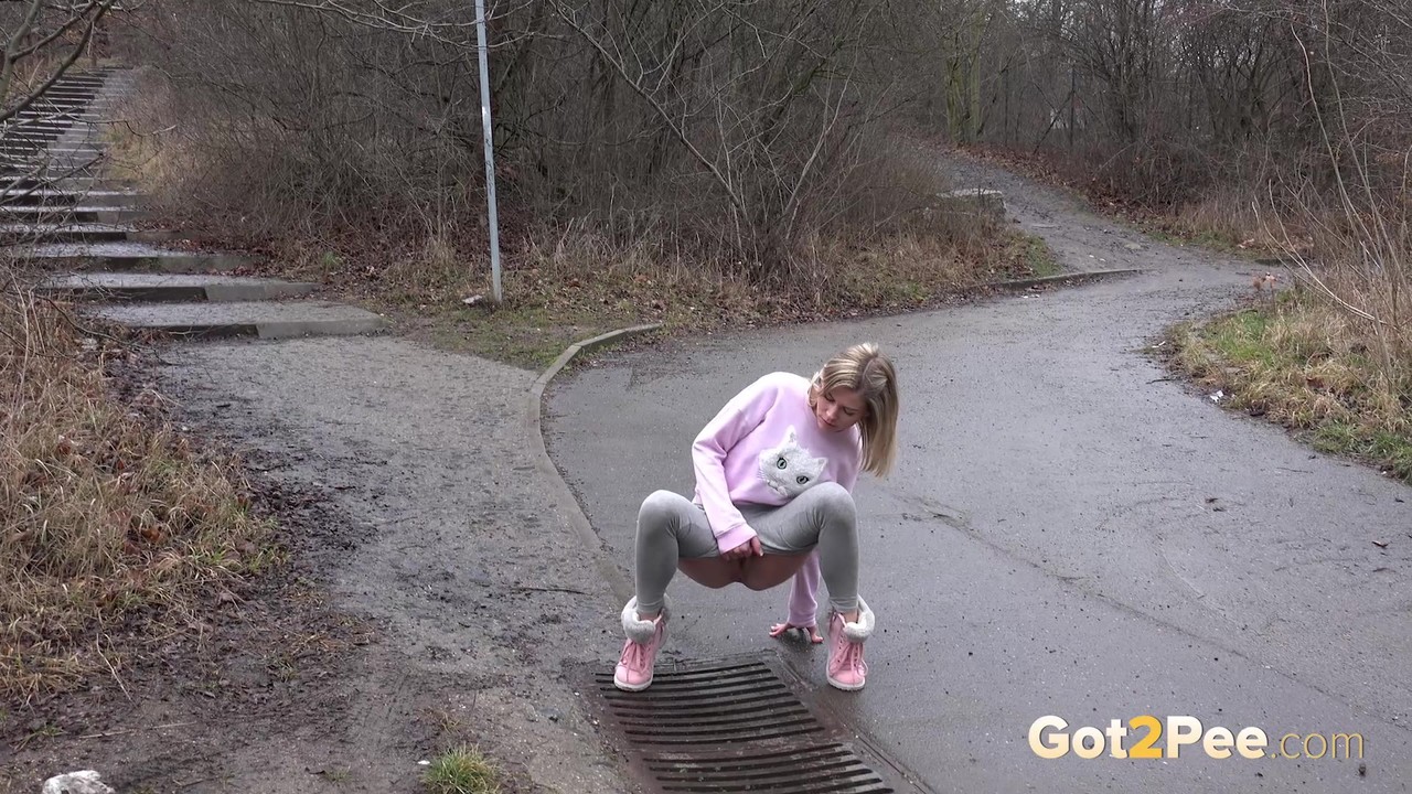 Blonde chick Claudia Macc takes an urgent piss over a storm drain 色情照片 #426382233