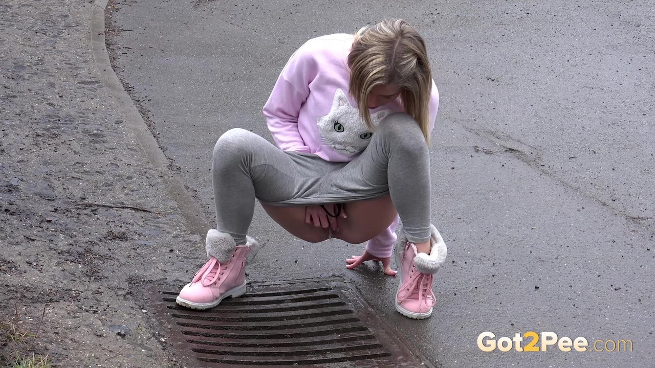 Blonde chick Claudia Macc takes an urgent piss over a storm drain foto porno #426382237