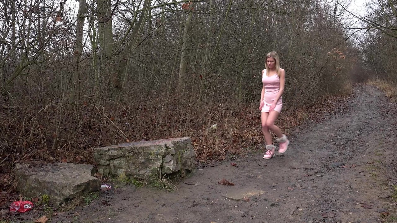 Blonde female Claudia Macc hikes up her short dress for a piss on a dirt path porn photo #427210079