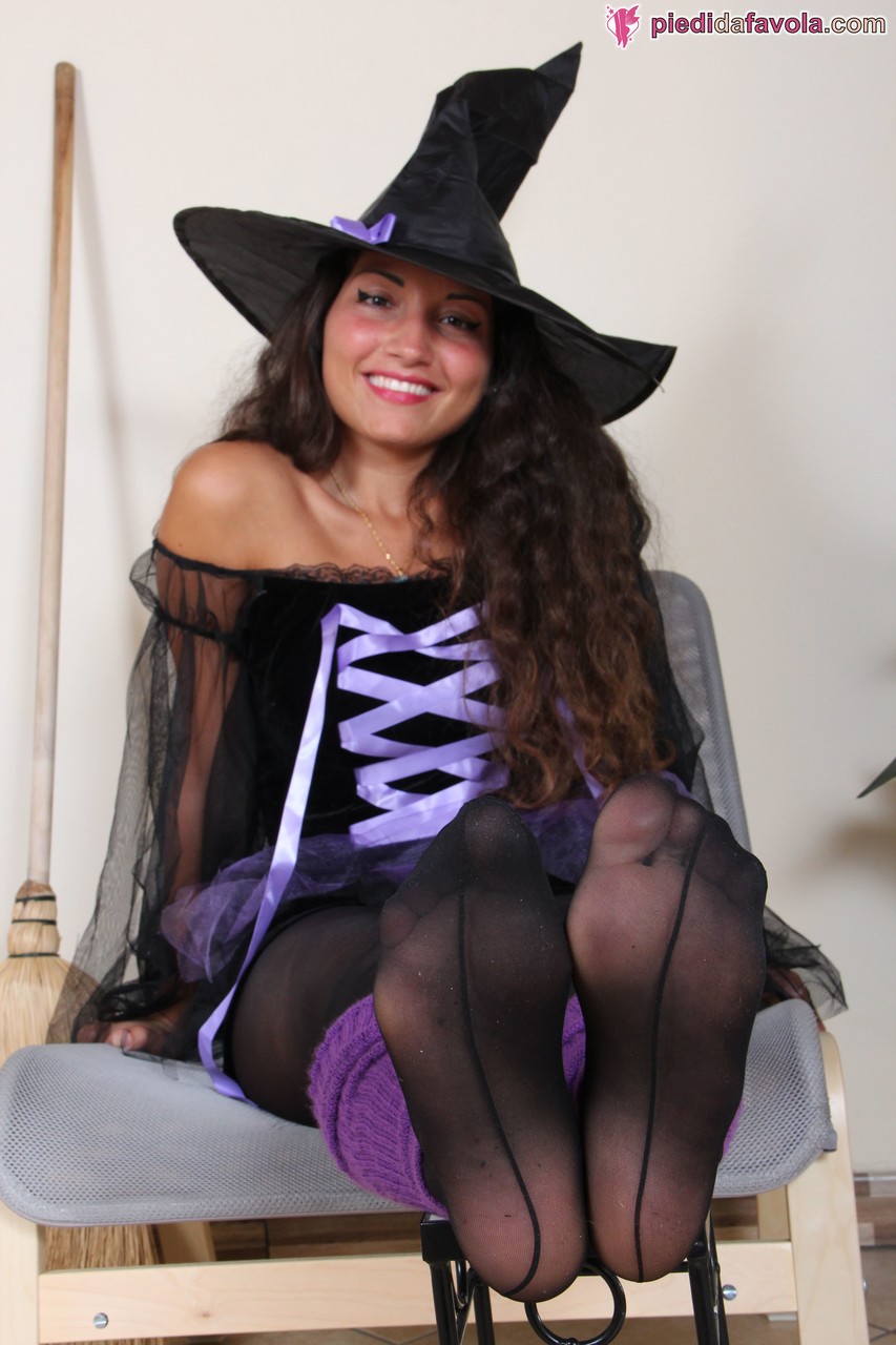 Teenage witch Gioia shows off her amazing feet and soles in black stockings porn photo #422894991