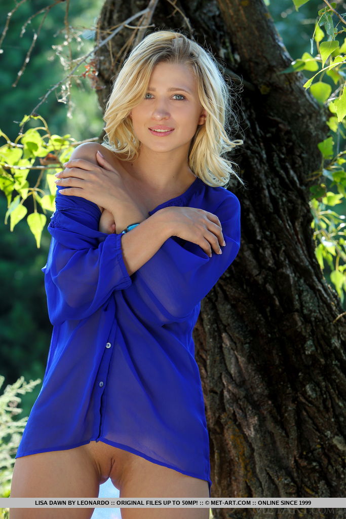 Petite blond teen Lisa Dawn delights in displaying her tight slit under a tree photo porno #426992989