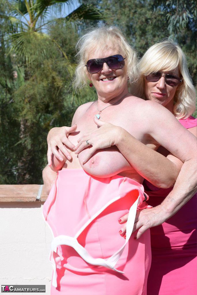Mature blonde Melody releases an older woman's breasts from a pink dress порно фото #425712716