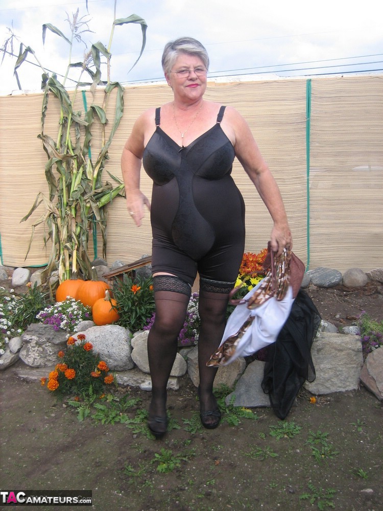 Fat nan Girdle Goddess sets her saggy boobs free of a girdle in the backyard porn photo #424879234