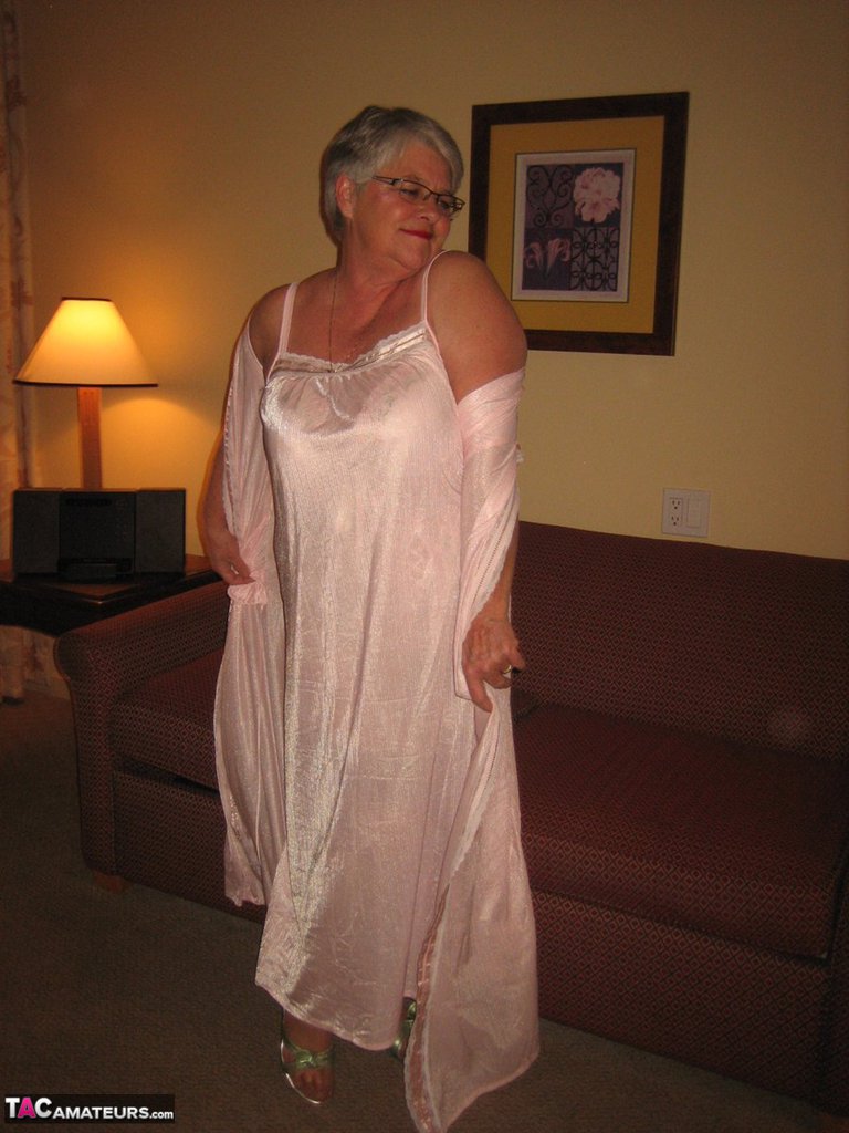 Amateur granny on the heavy side shows her pussy in lingerie and tan nylons porn photo #428616256