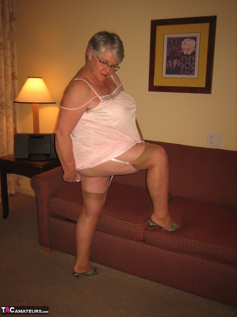 Amateur granny on the heavy side shows her pussy in lingerie and tan nylons porn photo #428616268