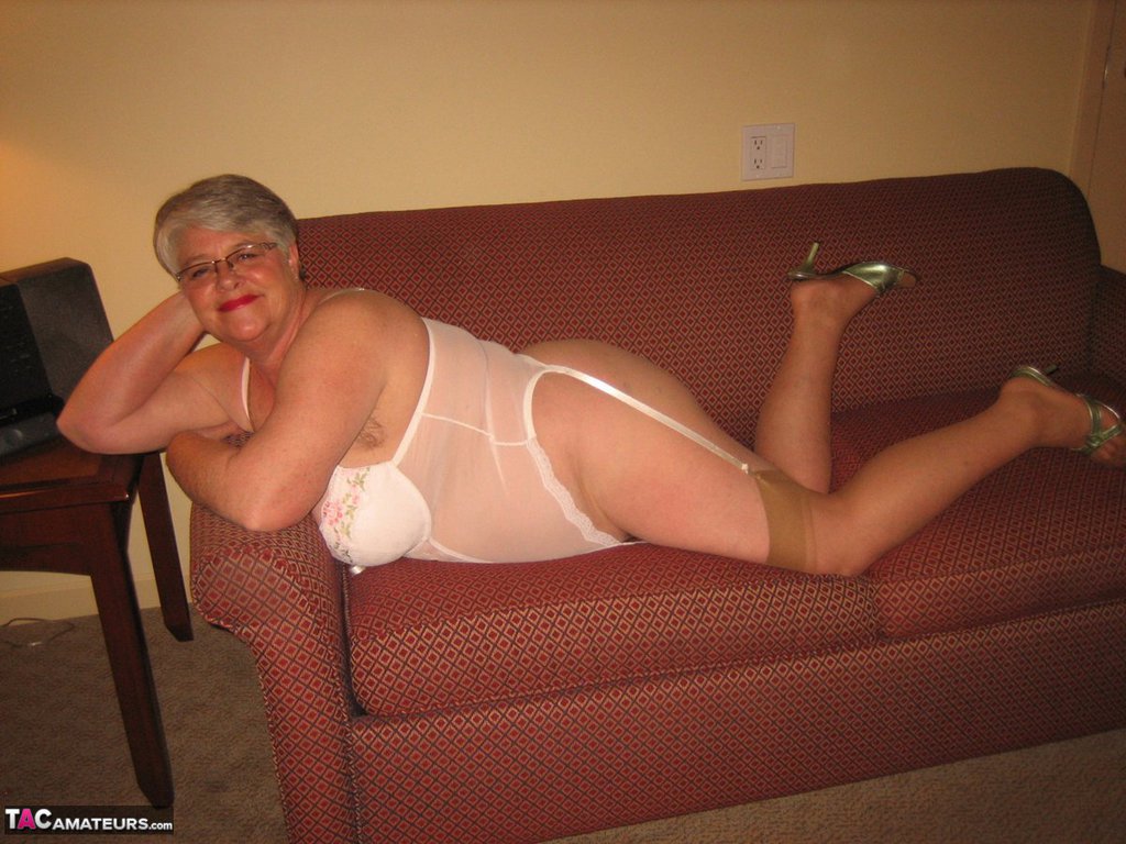 Amateur granny on the heavy side shows her pussy in lingerie and tan nylons porn photo #428569312