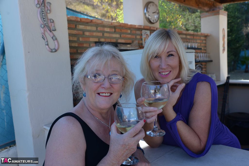Old women share a lesbian kiss after drinking to much wine out on the patio ポルノ写真 #425918818