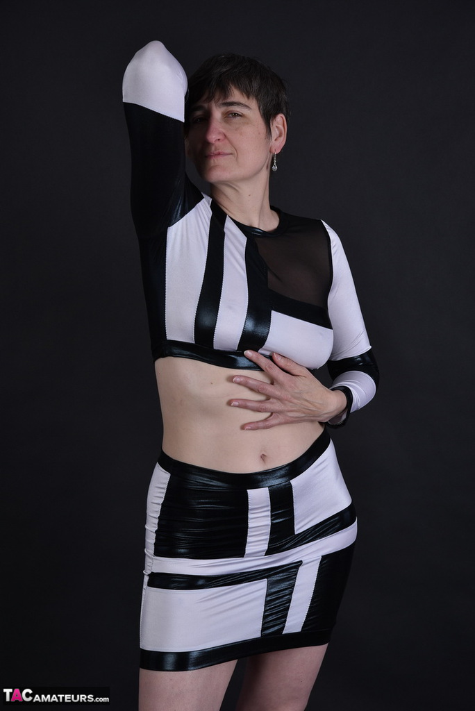 Her sagging tits and pussy are revealed to us for the first time when she walks behind her dark haired granny.