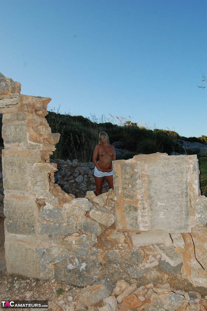 The naked poses are taken by the adult Sweet Susi on a construction site, where she is still in her prime.