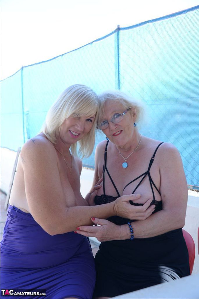 Older UK woman engage in softcore lesbian relations out on the patio porn photo #424613800