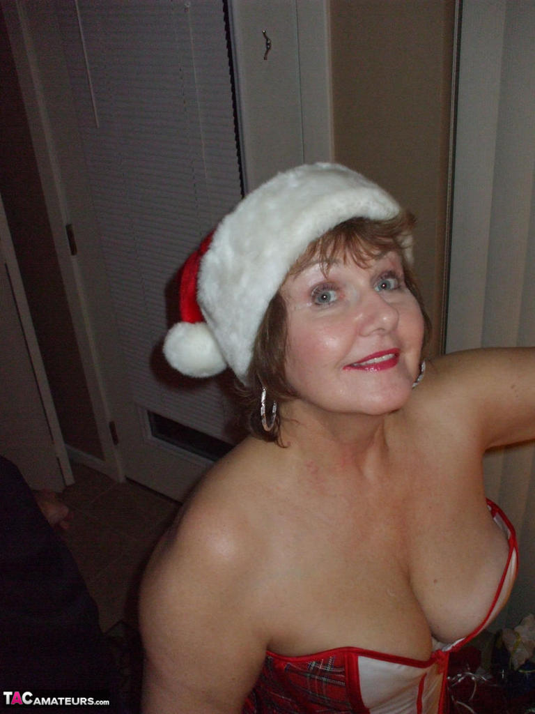 A young sex worker named Busty Bliss shows off her covered-up buttocks during Christmas.