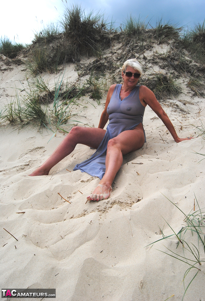 Beautiful busty mature Dimonty poses fully clothed in sheer dress at the beach foto porno #422585053