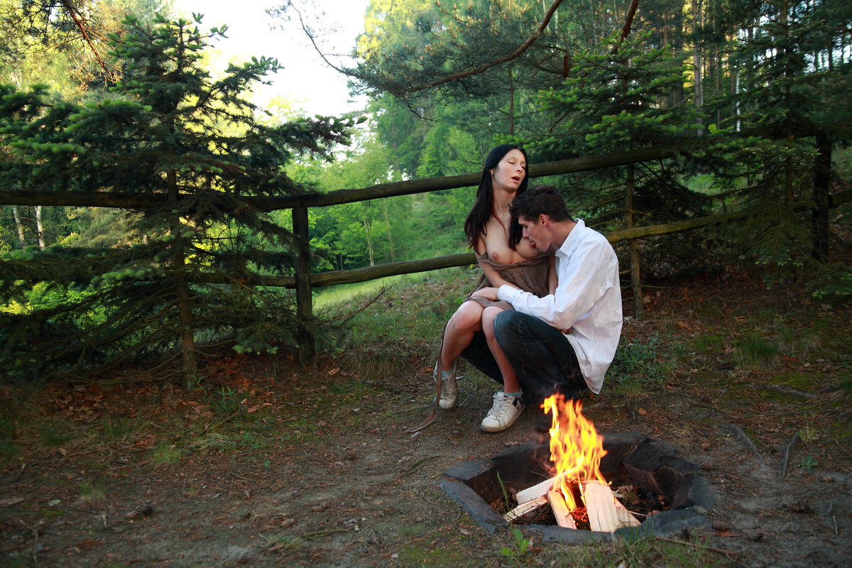 Horny couple have sexual intercourse near an outdoor fire pit foto porno #426964588