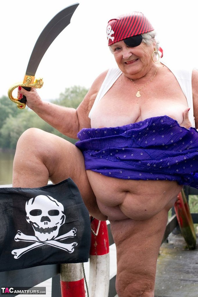 Fat British Granny Exposes Herself On A Bridge While Sporting Pirate Attire