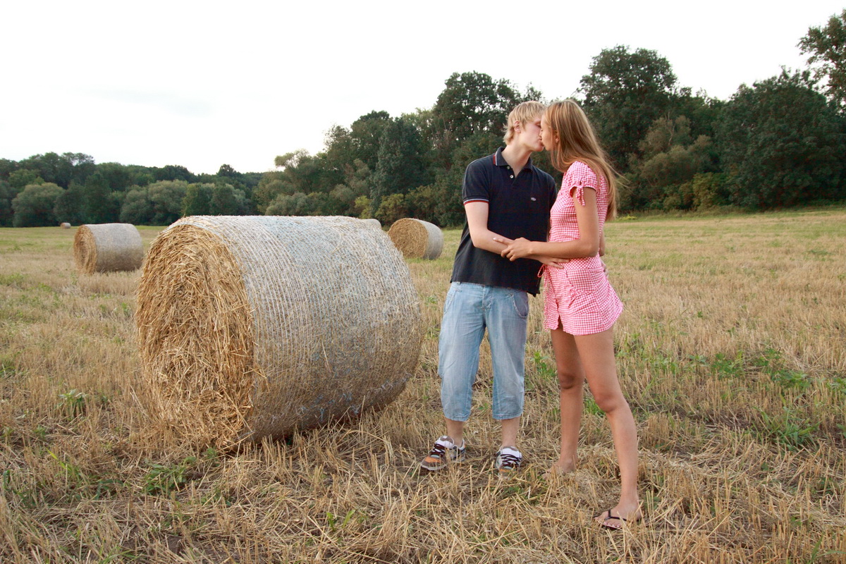 The soft bale of hay turns into the perfect location of these teen lovers They porn photo #423946749