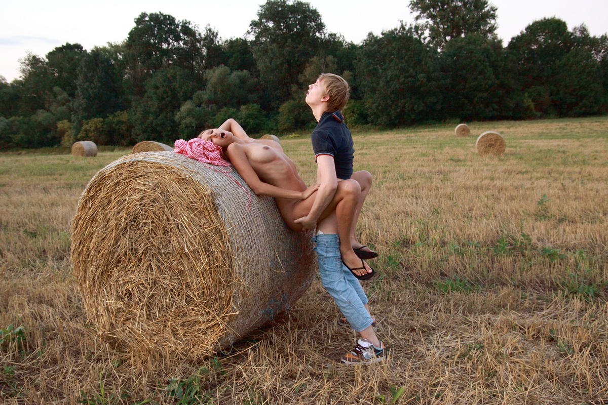 The soft bale of hay turns into the perfect location of these teen lovers They porn photo #423946760