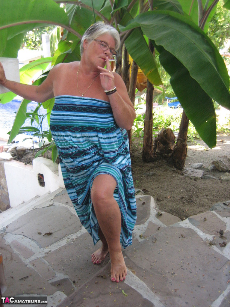Old woman Girdle Goddess smokes before exposing her fat body on her patio foto porno #429088066