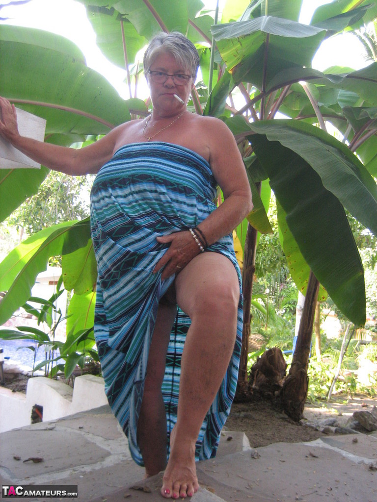 Old woman Girdle Goddess smokes before exposing her fat body on her patio foto porno #429088070
