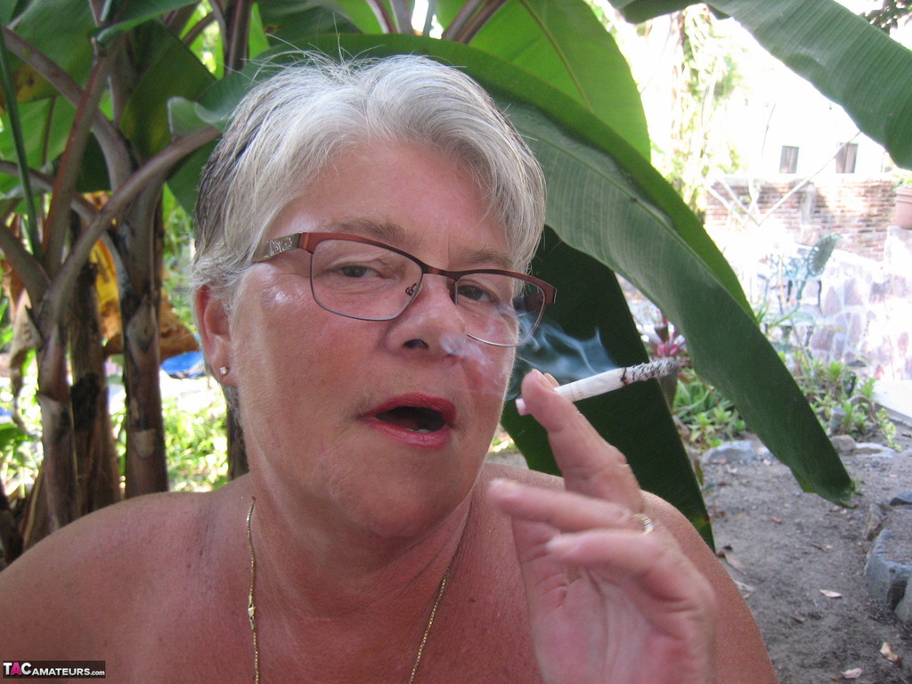 Old woman Girdle Goddess smokes before exposing her fat body on her patio foto porno #429088072