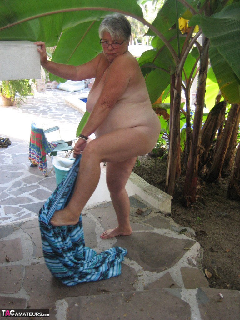 Old woman Girdle Goddess smokes before exposing her fat body on her patio porn photo #429088084