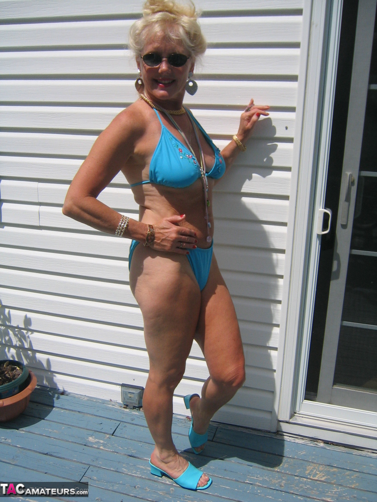Mature blonde Ruth frees her tits and ass from a bikini in sunglasses foto porno #424831635