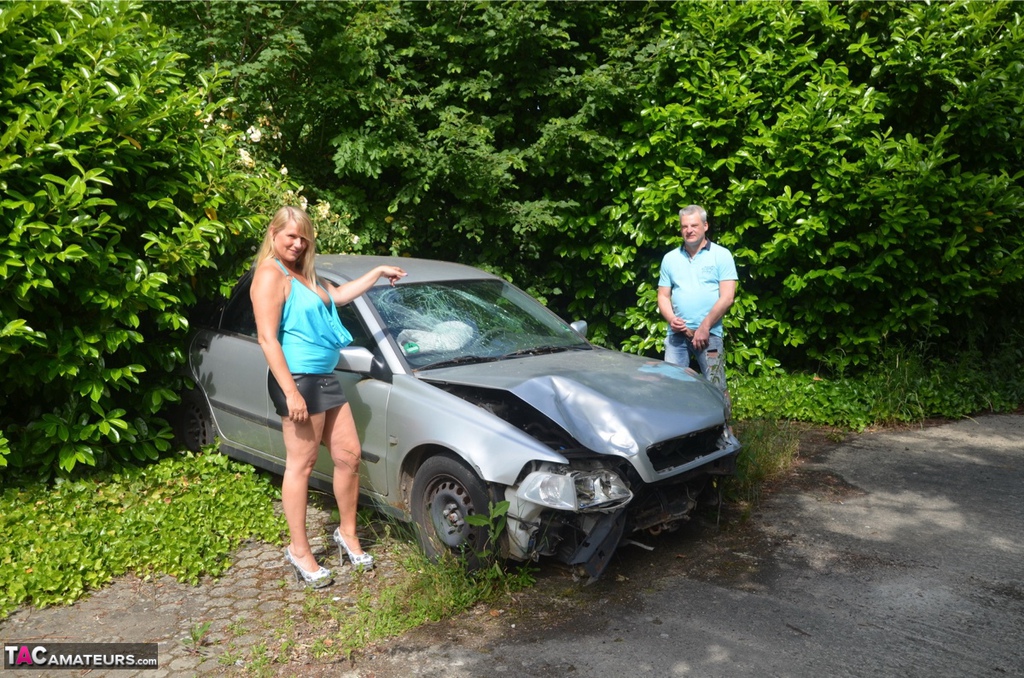Older Blonde Sweet Susi Sucks A Dick By A Wrecked Automobile In The Backyard