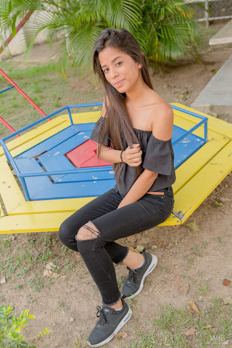 Smiley hot glamour girl Karin Torres looking sexy in ripped jeans on a swing porn photo #424794133