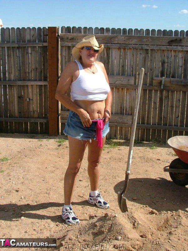 Before taking off, Adonna places her shovel in a heap of sand, which she does as an older blonde.