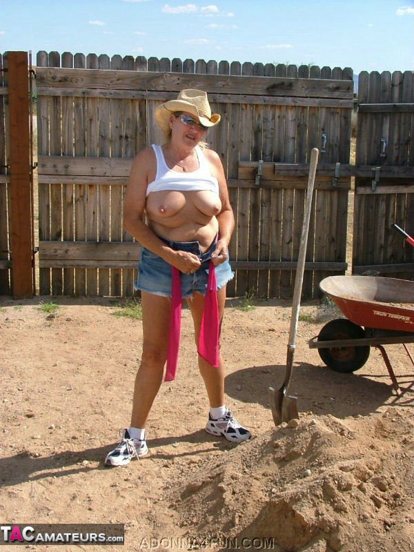 Adonna, being older and blonde, inserts her shovel into a heap of sand before stripping away.