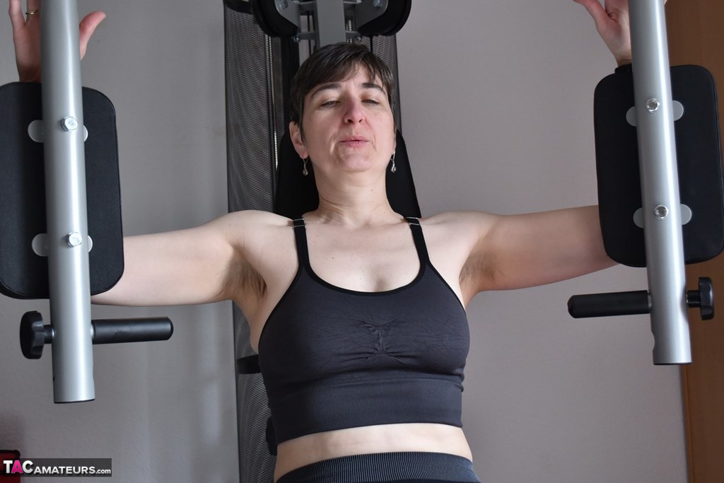 Fit Older Lady Shows Off Her Saggy Tits While Working Out At The Gym