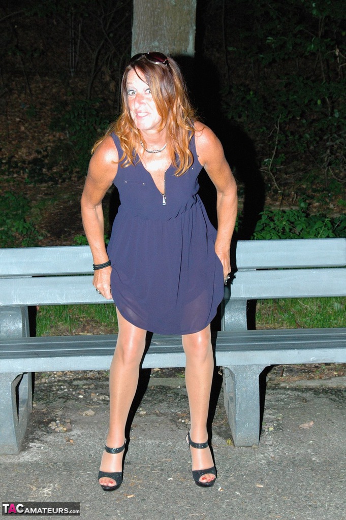 Amateur female pulls down her hose for a piss on park bench at night porn photo #424088291