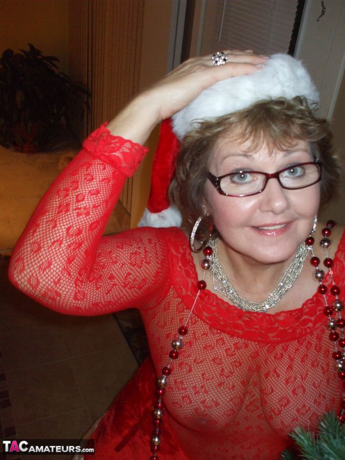 Mature amateur Busty Bliss shows her tits and twat after to much wine at Xmas