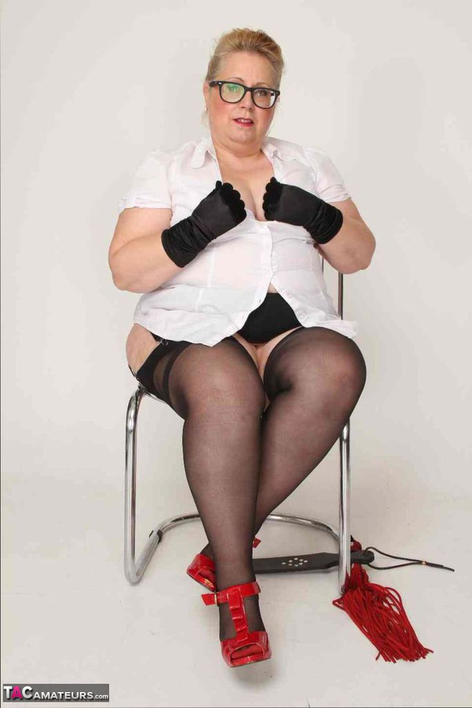 Exhibited: Obese UK blonde LexiE Cummings wears her gloves and nylon twat to show her tattoo.