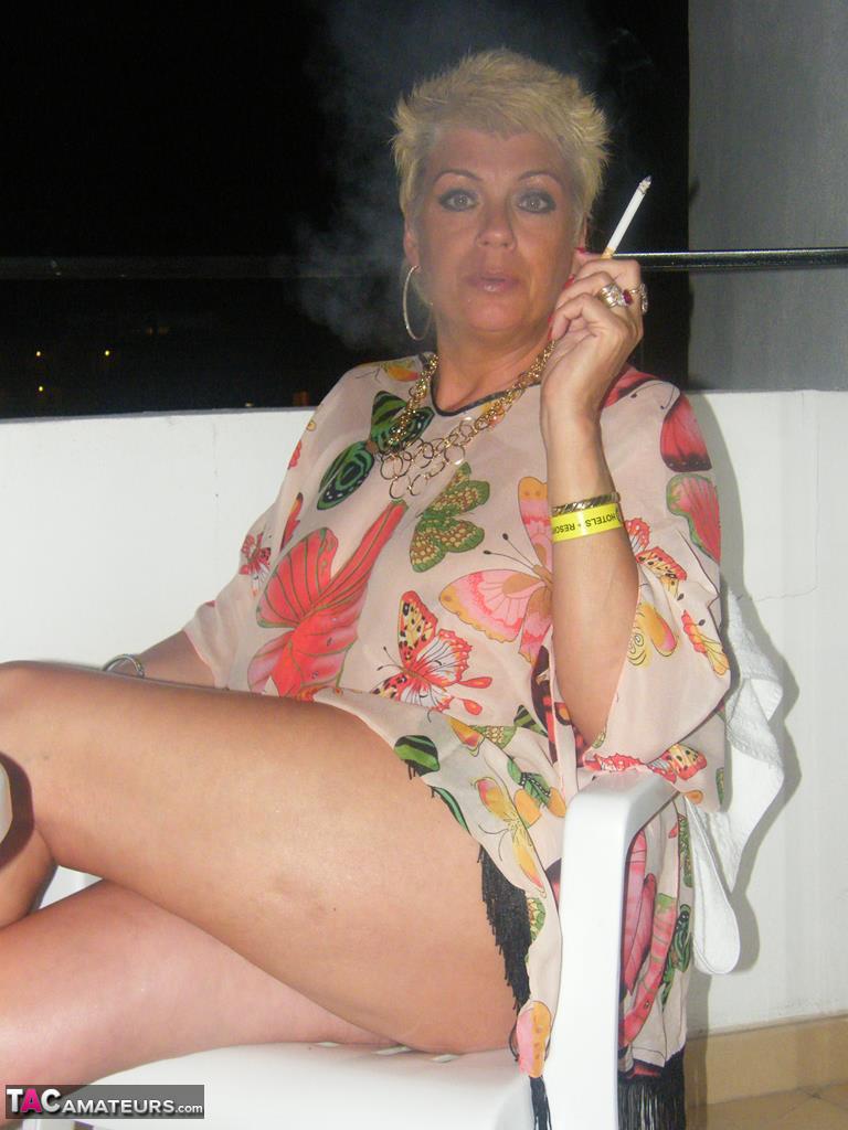 Middle-aged blonde Dimonty smokes while getting completely naked foto porno #426426019