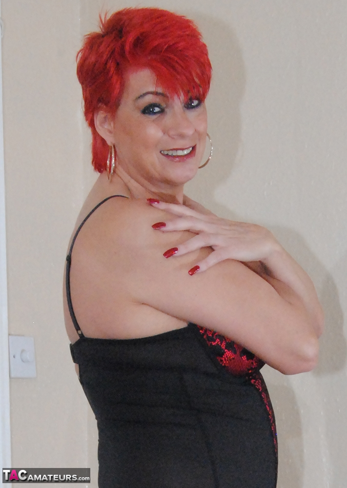 Older redhead Dimonty displays are natural tits and snatch in OTK boots foto porno #425399616