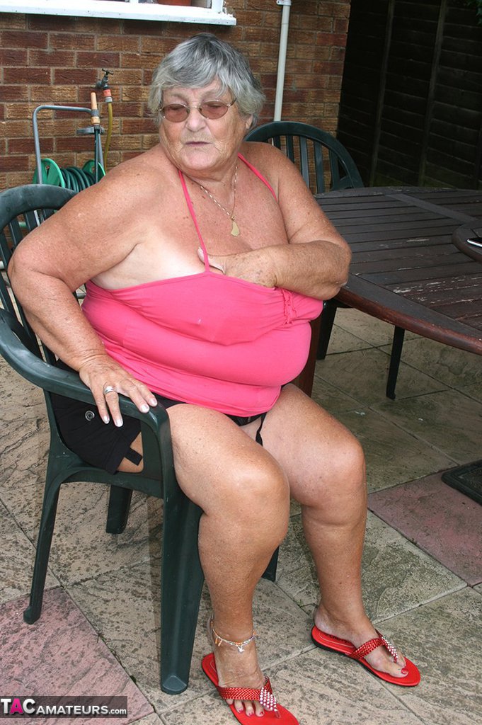 Fat oma Grandma Libby licks a nipple before baring her big ass on a patio porn photo #424608949