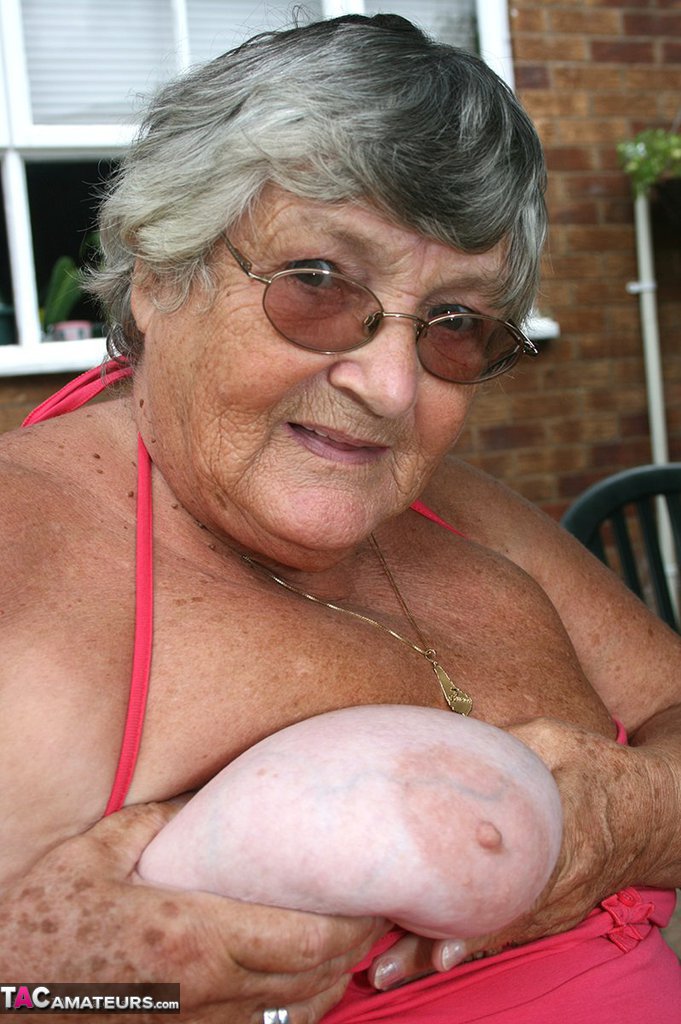 Fat oma Grandma Libby licks a nipple before baring her big ass on a patio porn photo #424608950