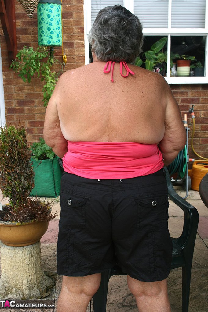 Fat oma Grandma Libby licks a nipple before baring her big ass on a patio порно фото #424608951