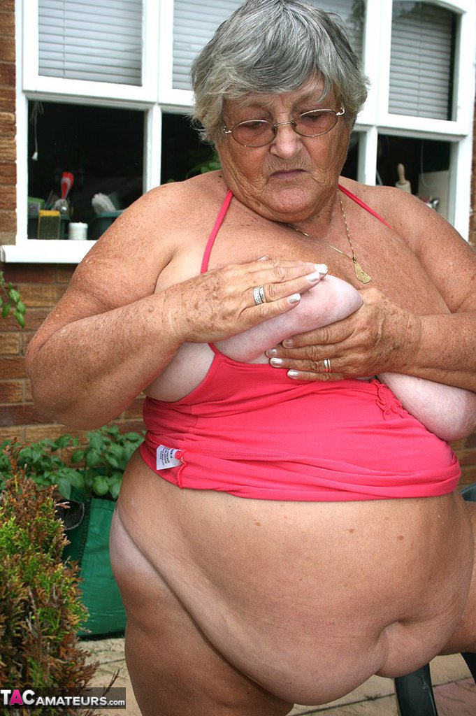 Fat oma Grandma Libby licks a nipple before baring her big ass on a patio porn photo #424558340