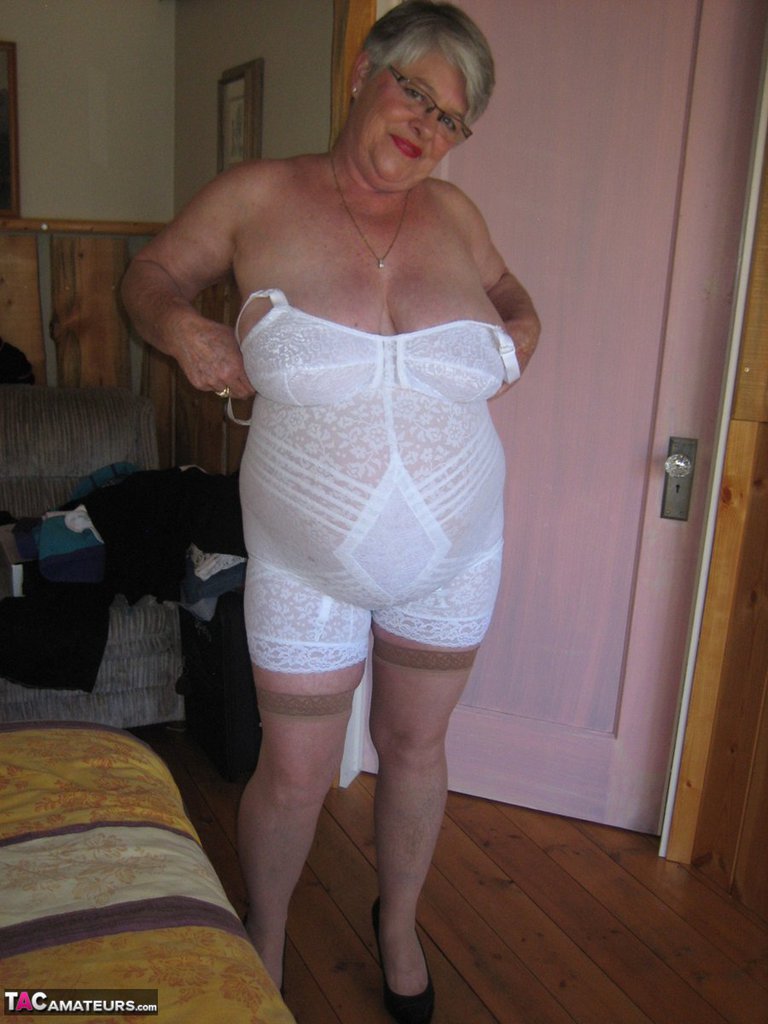 Fat granny Girdle Goddess exposes her pussy in crotchless panties and a gir...