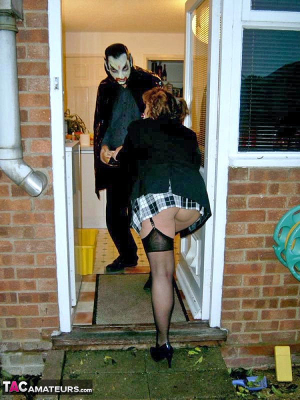 UK redhead Curvy Claire blows a man that is dressed as Dracula for Halloween porn photo #424858103
