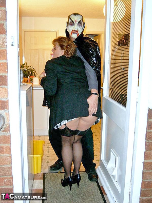 UK redhead Curvy Claire blows a man that is dressed as Dracula for Halloween porn photo #424730820