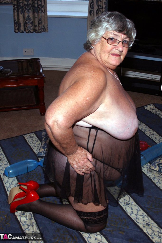 Overweight British woman Grandma Libby plays with balloon dildos in lingerie porn photo #428562427