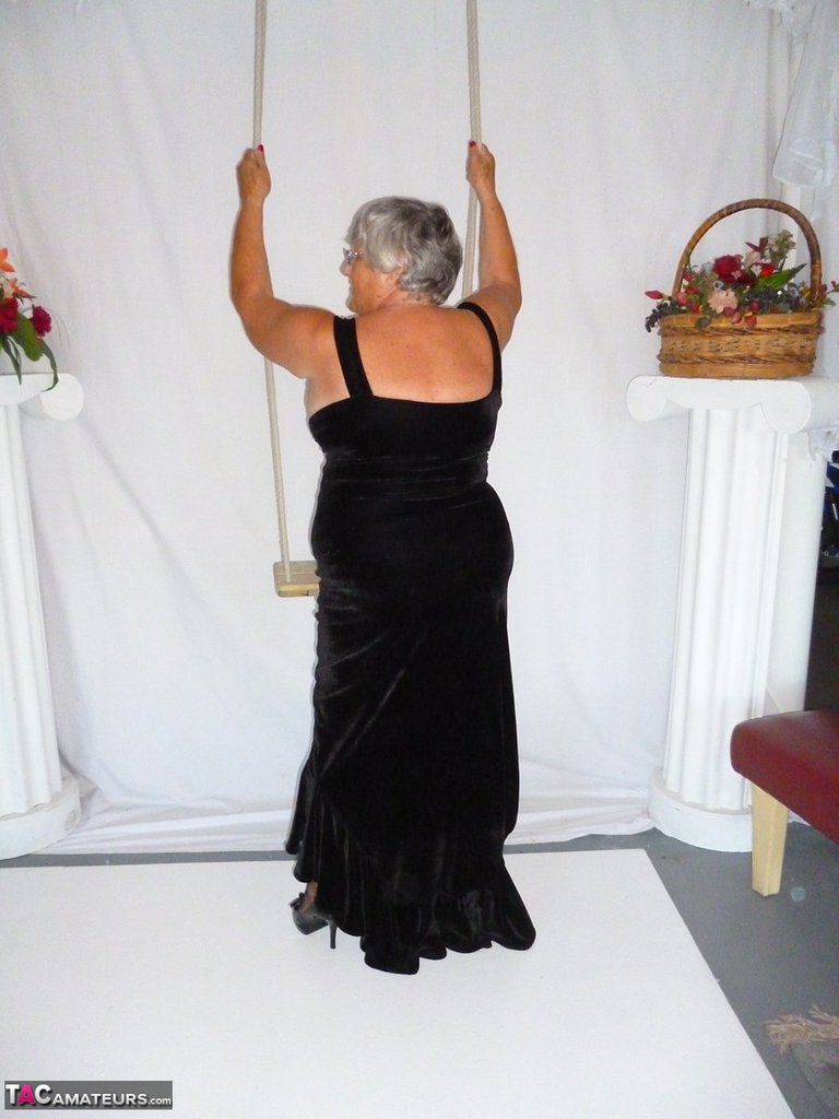 A naked version of Grandma Libby in stockings, dressed in a black dress, is shown.