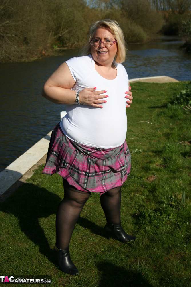 The naked Lexie Vummings, a fat amateur with an ankle cutout for her upskirt action, takes place by a river bank.